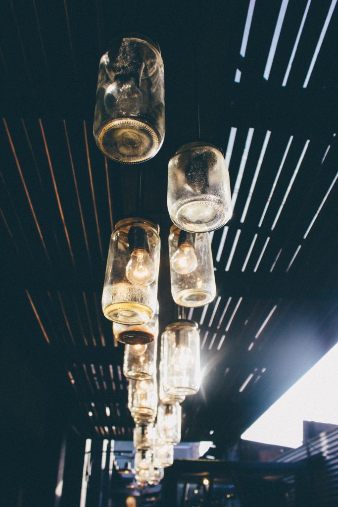 Close up of ceiling with a row of mason jar lighting