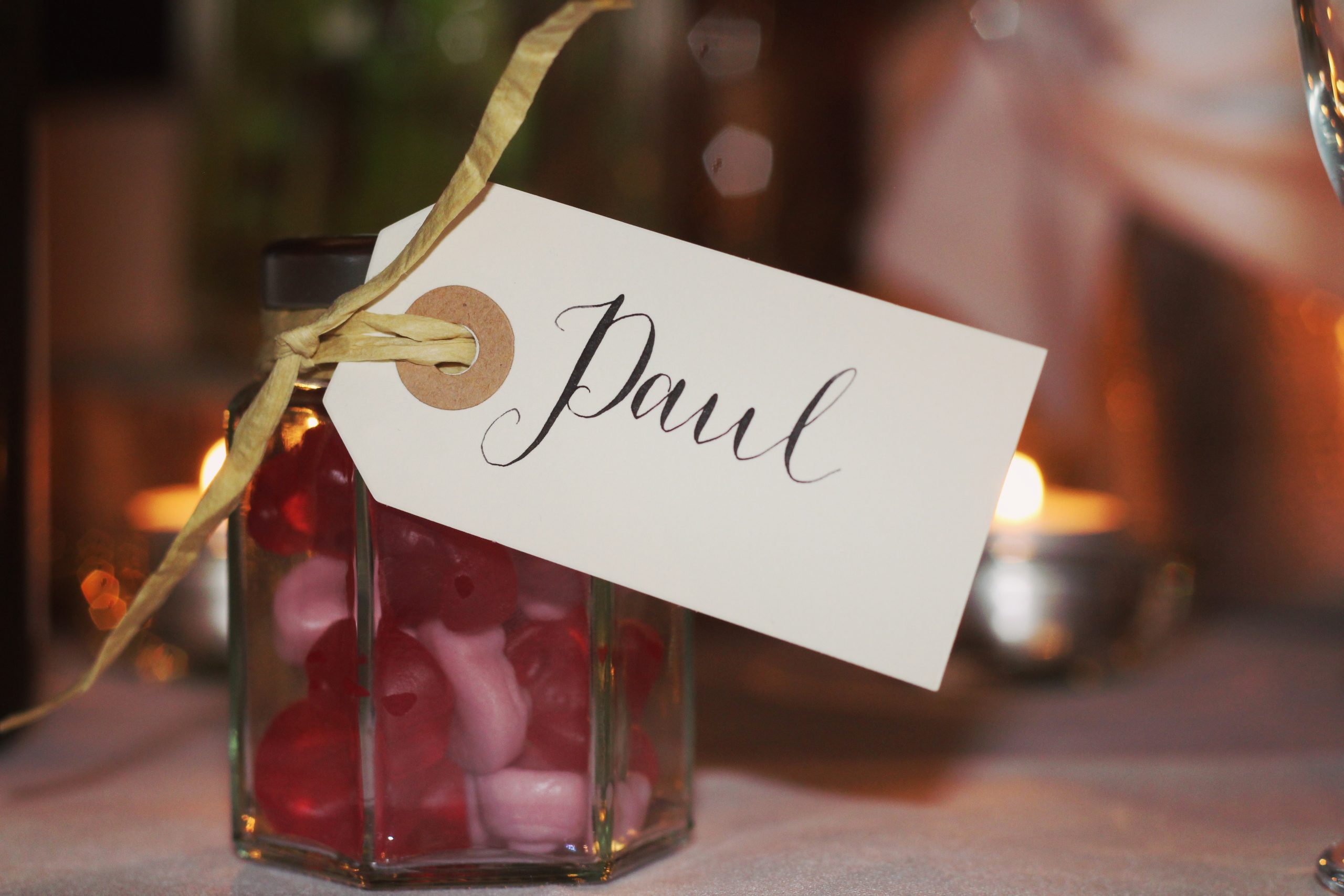 Small jar of candy with a name tag Paul as a wedding favour